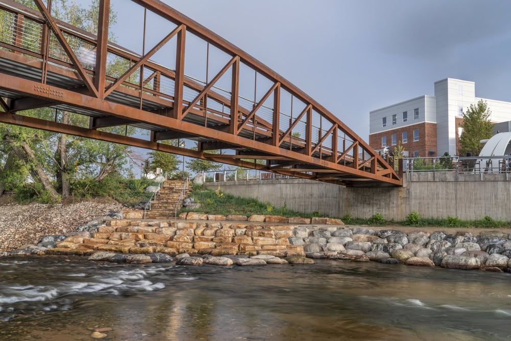 bike trail and footbridge - Cache la Poudre River at whitewater park in downtown of Fort Collins Colorado; Advantage Stone Fabrication