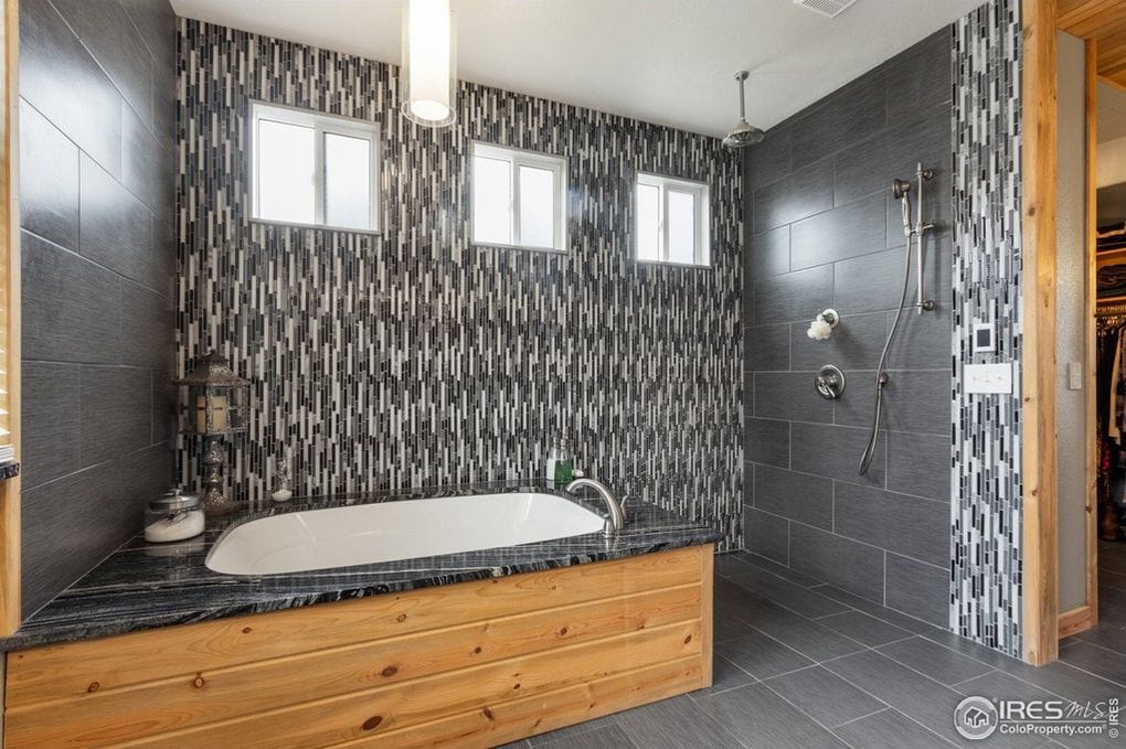 Modern bathroom with tub and shower in Longmont