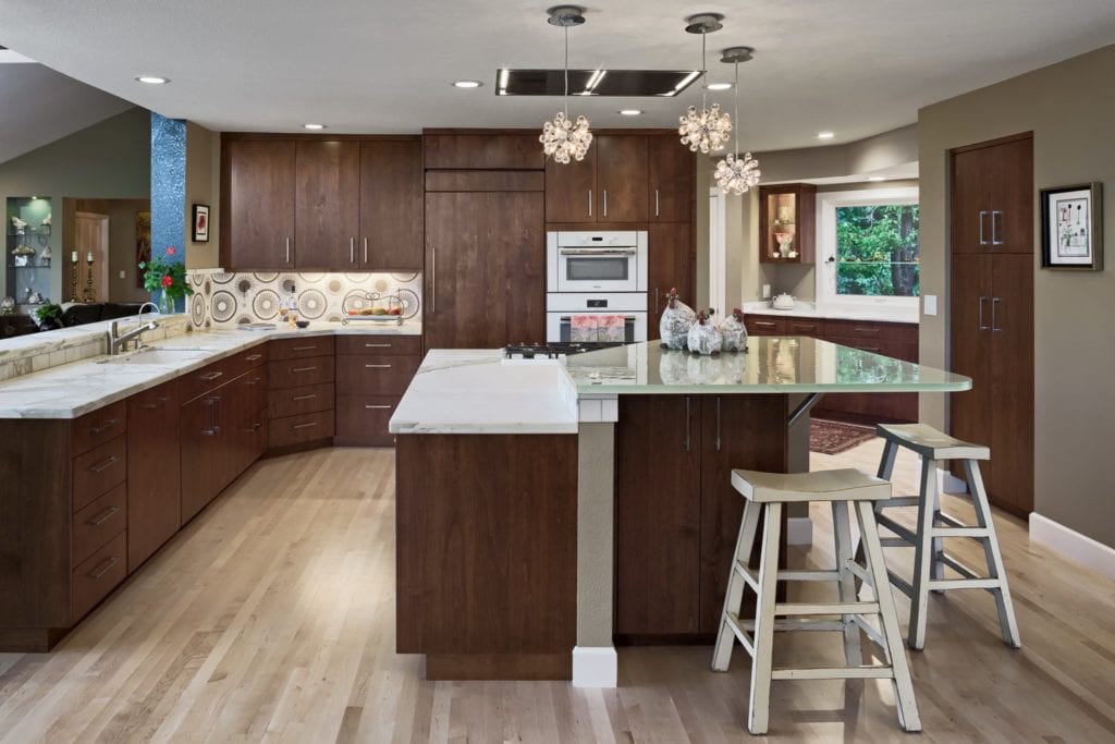Modern kitchen with dark wood cabinets and island.
